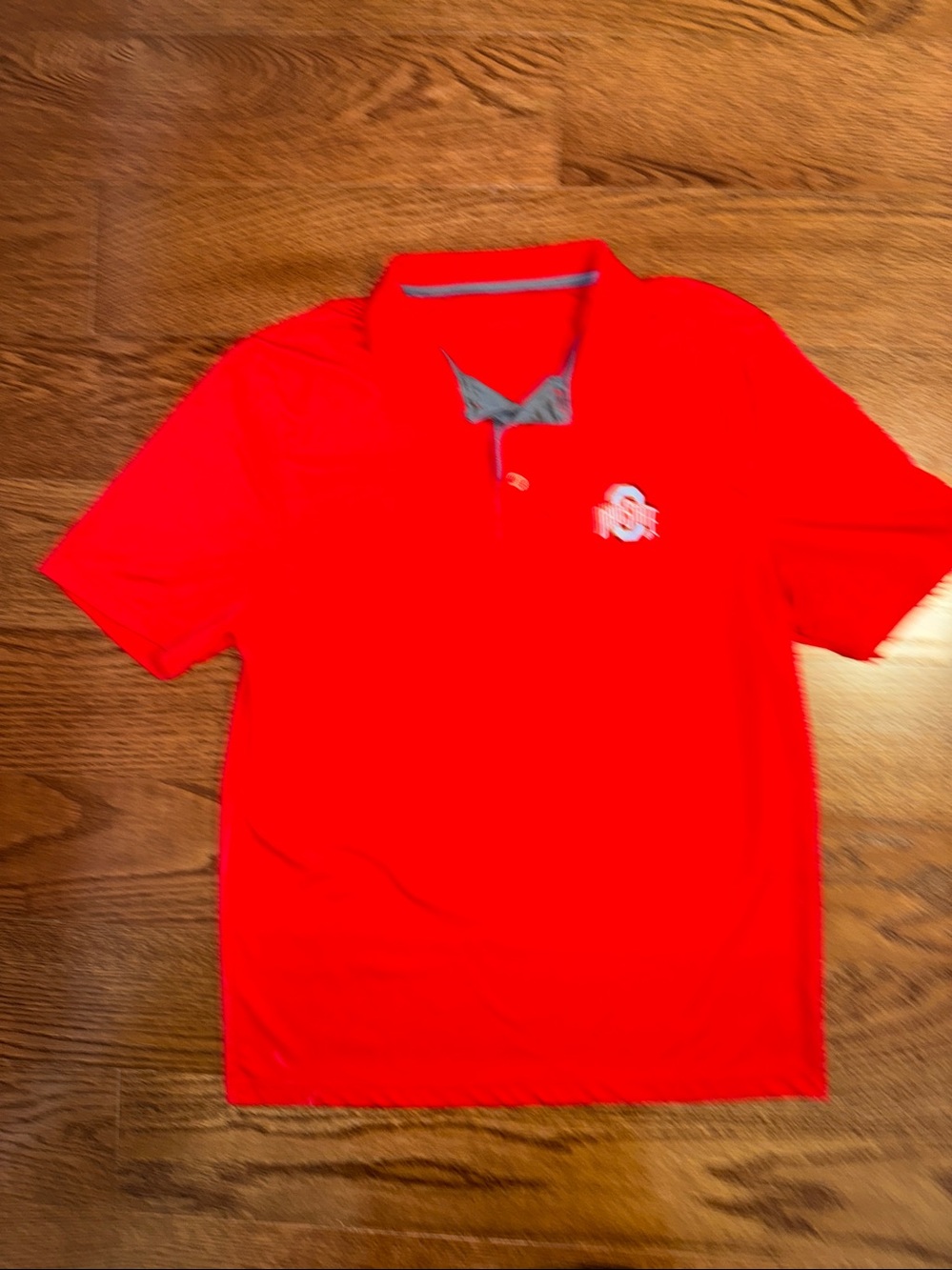 Men’s medium Ohio State red polo shirt.